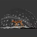 Cute Spotted Fawn Standing Inside Glass Globe On Snowy Ground With Falling Snowflakes