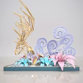 Handcrafted Decorative Sculpture With Golden Geometric Structure And Colorful Paper Flowers On Black Striped Tray