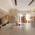 Modern Clothing Store Interior With Fashion Display Clothes Racks Cashier Counter And Green Plants
