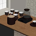 Black Tea Set On Wooden Table With Electric Kettle Tea Cups And Geometric Wall Decor
