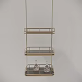Golden Three Tiered Shelf with Metal Railings and Transparent Patterned Bottles on Bottom Two Tiers