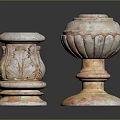 Two Classical Stone Pillars With Carved Leaf Patterns And Textured Bases