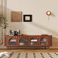 Wooden Brown TV Stand with Glass Doors Decorations and Potted Plant by Light Colored Wall