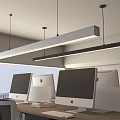 Linear Pendant Lights Over Modern Office Workspace With Computers City View And Wooden Desk