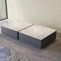 Two Modern Coffee Tables With Marble Top And Dark Gray Base On Gray Rug
