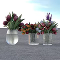 Three Transparent Glass Vases With Colorful Tulips Lavender And Mixed Flowers On Gray Floor