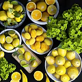 Fresh Assorted Fruits With Sliced Oranges Lemons Whole Bananas Pears in White Marble Bowls