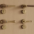 Vintage Brass Door Handles With Keyholes On Wooden Panel Surface