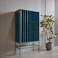 Blue Console Cabinet With Vertical Slat Design And Green Plant In Indoor Entryway