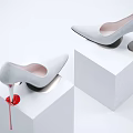 White High Heels Showcased On White Pedestals With Dripping Design Details