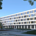 Modern School Building With Contemporary Design Large Windows Front Courtyard Greenery And Sculptures