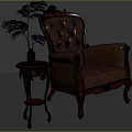 Antique Leather Armchair With Carved Details And Wooden Side Table With Green Plant
