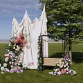 Scenic Outdoor Photo Spot With White Drapes Colorful Flowers Swing Bench Green Trees And Grass