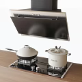 Modern Kitchen Appliances With Stainless Steel Range Hood Gas Stove And Pots On Wooden Countertop