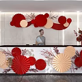 Elegant Reception Desk Area With Red And Beige Paper Flower Decorations And Vase