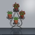 Potted Plants Displayed On Three Tier Black Iron Stand With Red Flowers And Green Leaves