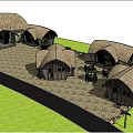 Traditional Thatched Roof Huts In Outdoor Leisure Area With Trees Tables Umbrellas And People