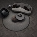 Gray Curved Sofa And Round Coffee Table With Plush Pillows Circular Rug And Accent Armchair