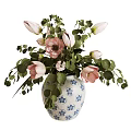 Blue and White Floral Patterned Vase with Pink Blooms and Green Leaves