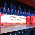 YSMD Woodworking Studio Cultural Evening With Bright Stage Lighting And Audience Seats