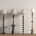 Floor Lamps With Various Spiral Cone Spherical Bases Black Brown Against White Wall Wooden Floor