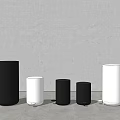 Public Facility Waste Bins Various Sizes Black And White Cylindrical Against Gray Wall On Floor