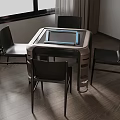 Contemporary Dining Table With Glass Top And Four Black Chairs In Bright Room