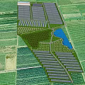 Aerial View Planning of Agricultural Area With Organized Farmland Greenhouses Water Pond and Paths