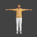Man in Yellow Hoodie White Pants and Green Shoes With Arms Outstretched Against Gray Background