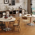 Modern Dining Space With Round Tables And Mixed Style Chairs On Herringbone Floor
