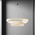 Modern Hanging Chandelier With Circular Layered Design And Illuminated White Rings In Interior Space