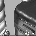 Two Black Textured Surface Luggage Pieces With Wheels And Different Sizes 3d model