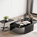 Modern Black Coffee Table Design With Sleek Side Table Green Plant Glassware And Books