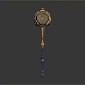 Ornate Golden And Blue Hammer Weapon With Circular Decorative Head And Intricate Handle Structure