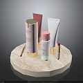 Various Cosmetic Products On Marble Display Stand Including Bottles And Lipstick