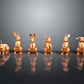 Six Copper Colored Rabbit Sculptures In Various Poses With Black Background Reflections
