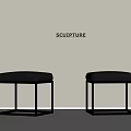 White Wall With Sculpture Sign And Two Black Leather Metal Frame Stools On Gray Floor