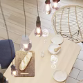 Modern Wooden Dining Table Set With Rattan Chairs Blue Cushion White Paneled Wall Pendant Lights