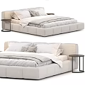 Modern Beige Upholstered Double Bed Interior With White Gray Pillows Quilt And Black Nightstand