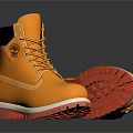 Yellow Boots With Red Soles And Laces On Dark Background With Reflections