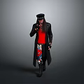 Man in Black Long Coat Red Top Colorful Pants and Black Cap