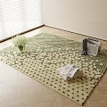 Square Green Beige Star Pattern Rug on Wooden Floor with White Flowers and Magazine Rack