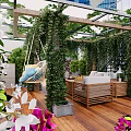 Garden Landscape With Wooden Deck Vine Covered Pergola Hanging Swing Chair And Colorful Flowers