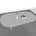 White Oval Perforated Coffee Table With Gray Vase And Square Object On Gray Carpet 3d model