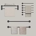 Towels On Wall Mounted Black Racks With Light Colored And Striped Designs