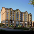 Classical Beige Residential Building With Multi story Windows Landscaped Gardens Walking Paths And Benches