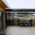Outdoor Living Space With Black Metal Pergola Table Blue Stools And Plants