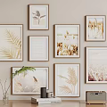 Multiple Landscape Paintings With Golden Frames Featuring Natural Elements On Beige Wall 3d model