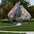 Modern Geometric Outdoor Pavilion With Wooden Panels Green Lawn Curved Pathway And Trees