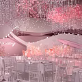 Elegant Pink Banquet Hall Interior With Crystal Chandeliers Round Tables And Flowers